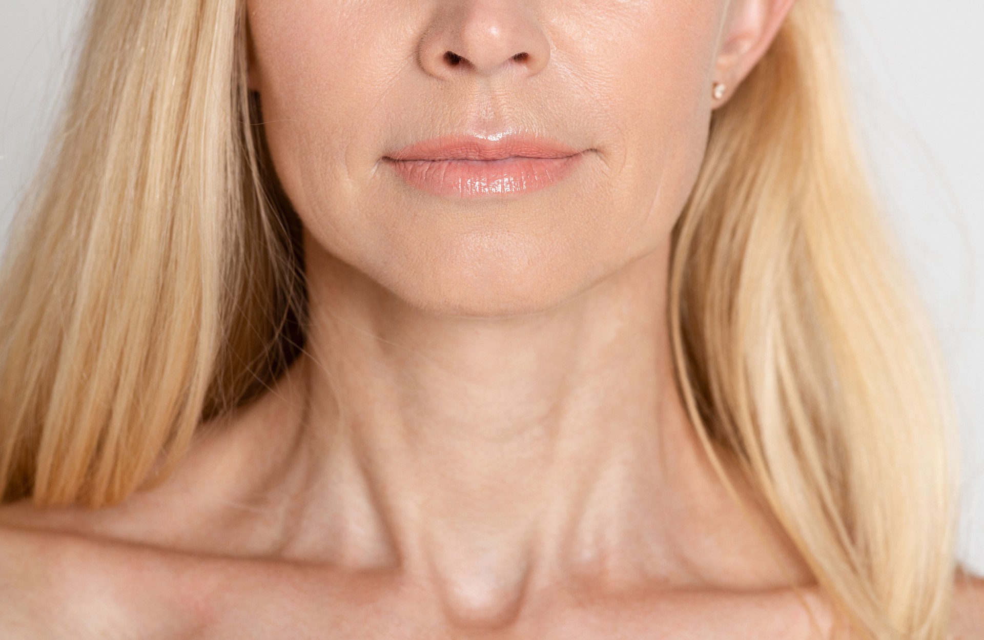 Close up of a Woman With Long Blonde Hair Showcasing Natural Beauty and Smooth Skin
